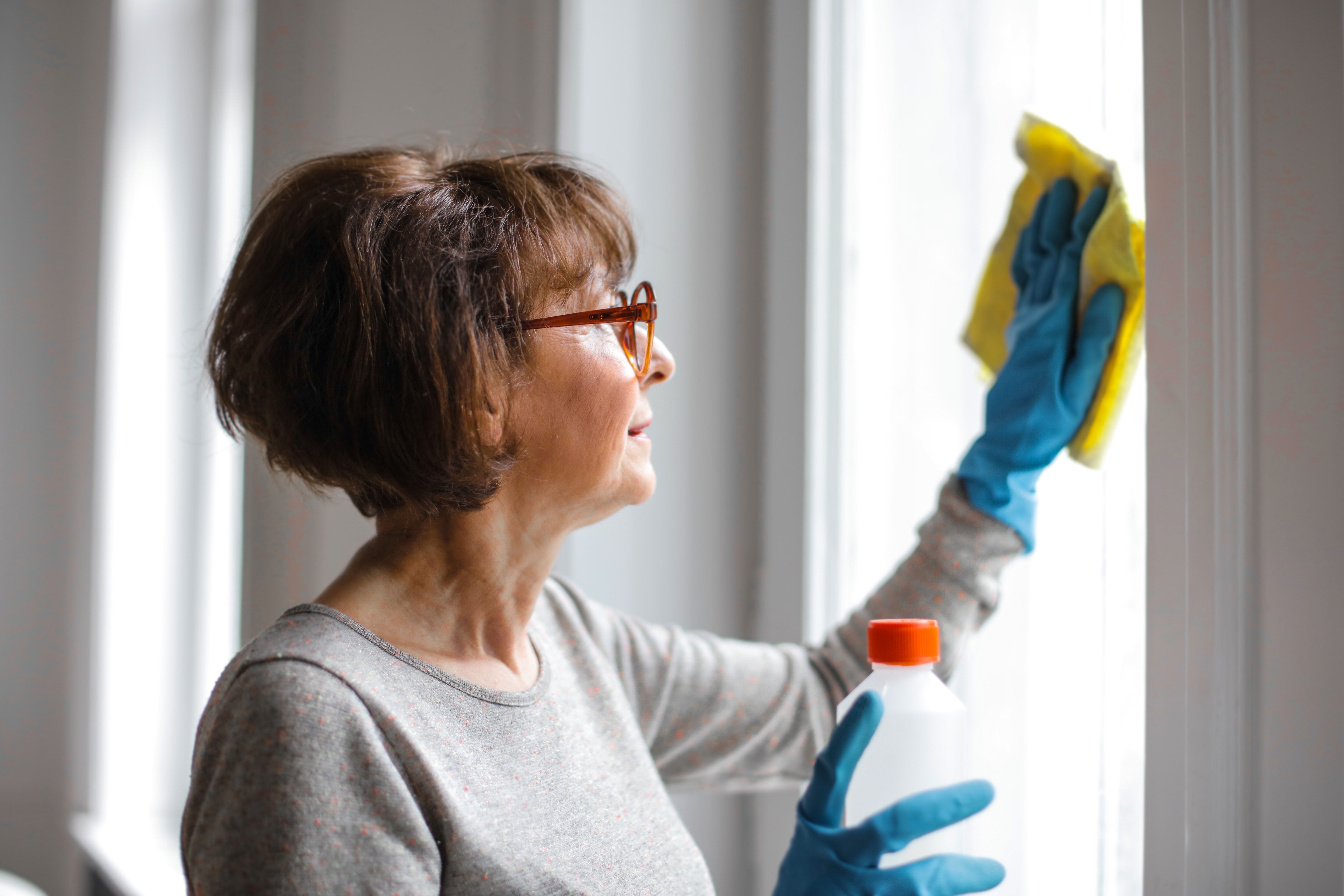 Woman Cleaning Glass Windows - How to Clean Glass Flooring